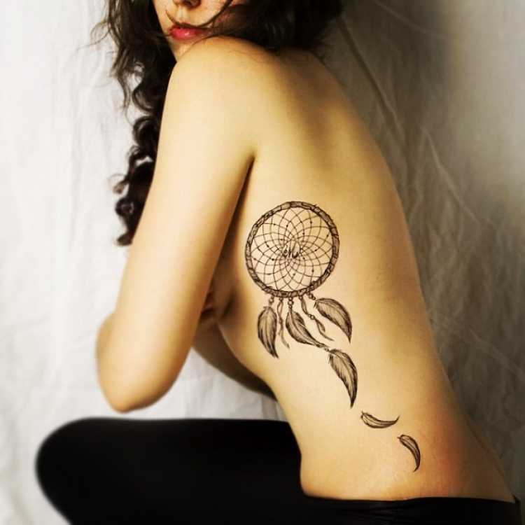 Female rib tattoo