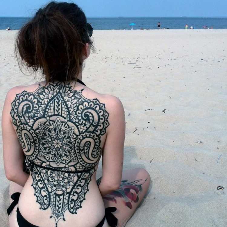 Woman with tattoo on her back