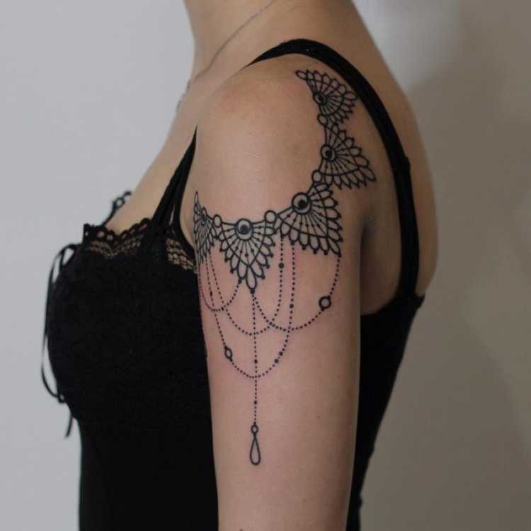 Female shoulder and arm tattoo