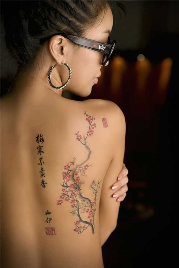 Woman with part of her back tattooed