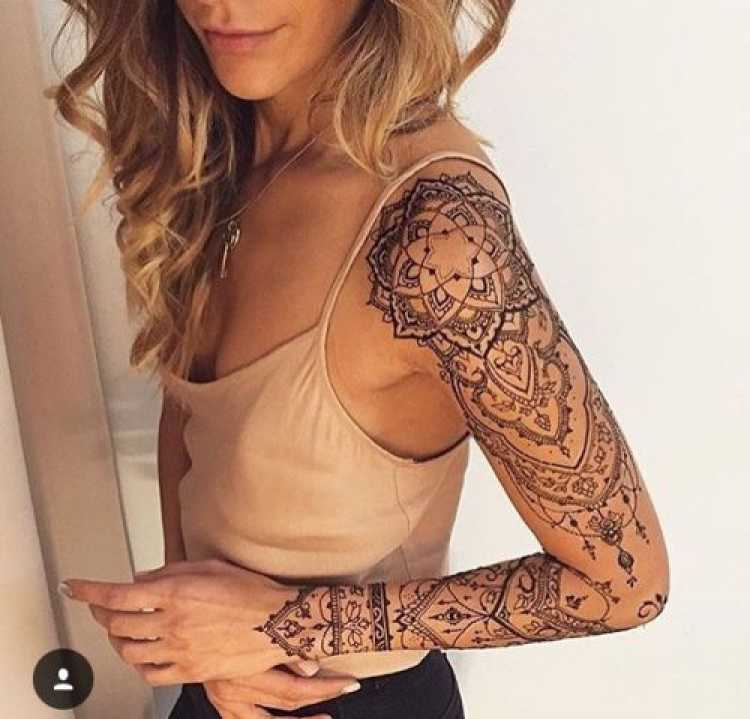 Woman with tattooed arm