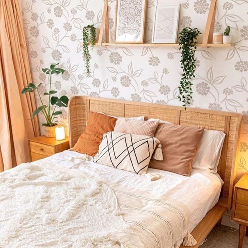 Small double bedroom decorated with wallpaper.