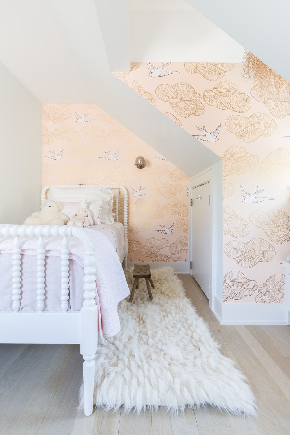 Bedroom with pink wallpaper