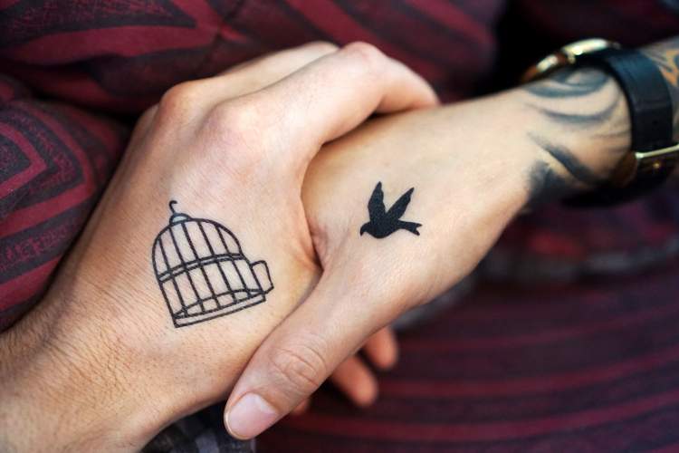 Mother and daughter tattoo: bird and cage