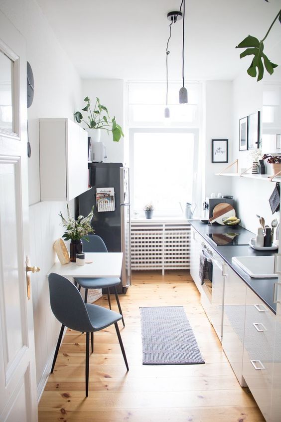 Small kitchen decorated in white and gray