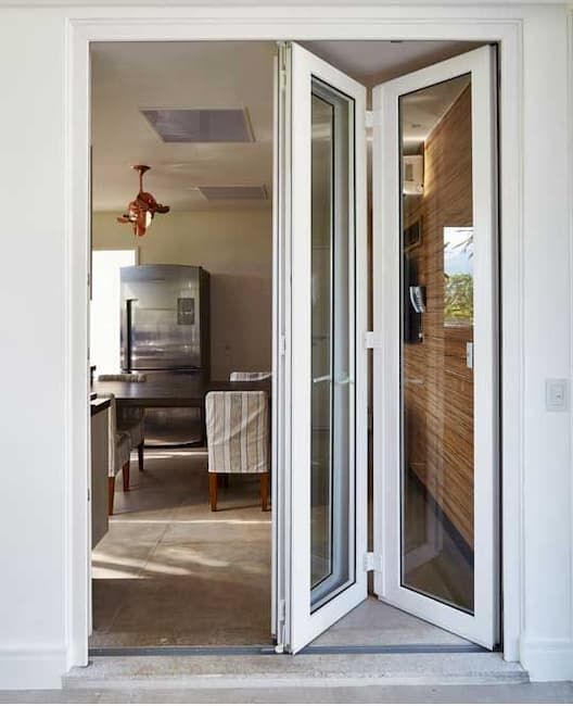 Glass door with white frame.