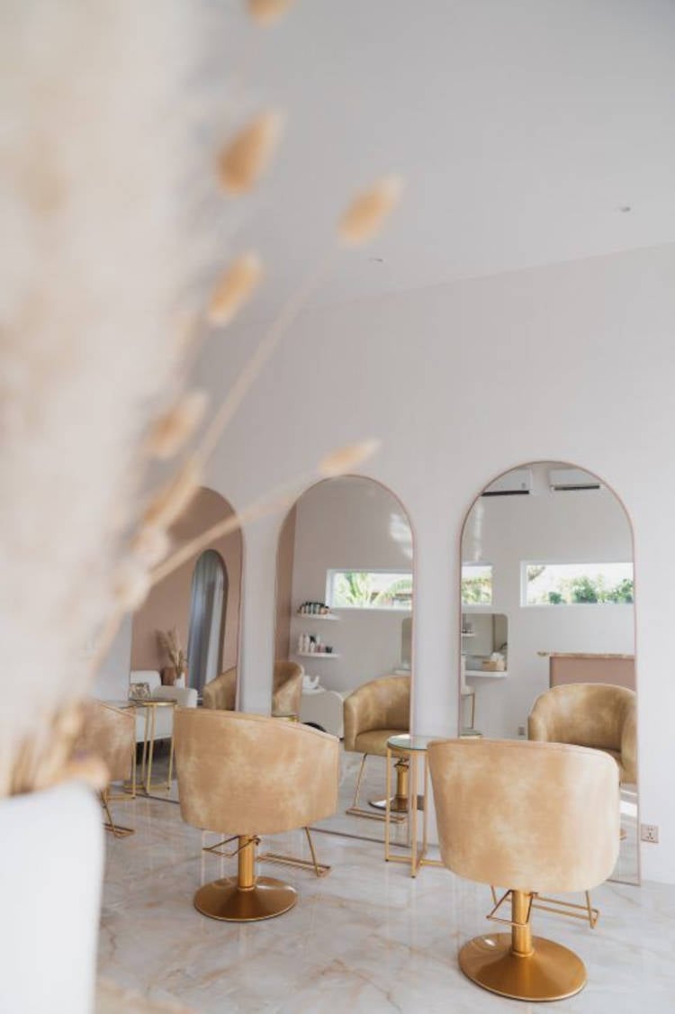 Large mirrors and velvet armchairs.