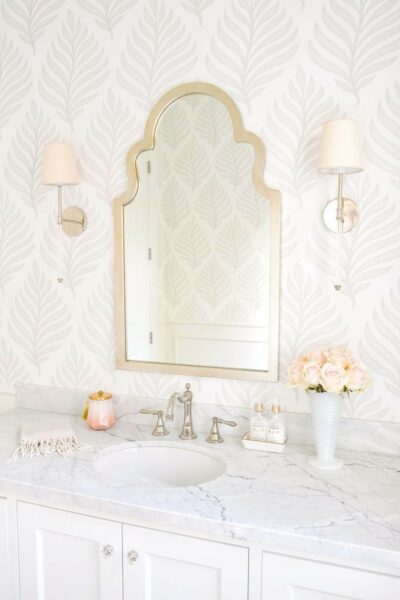 Bathroom with wallpaper.