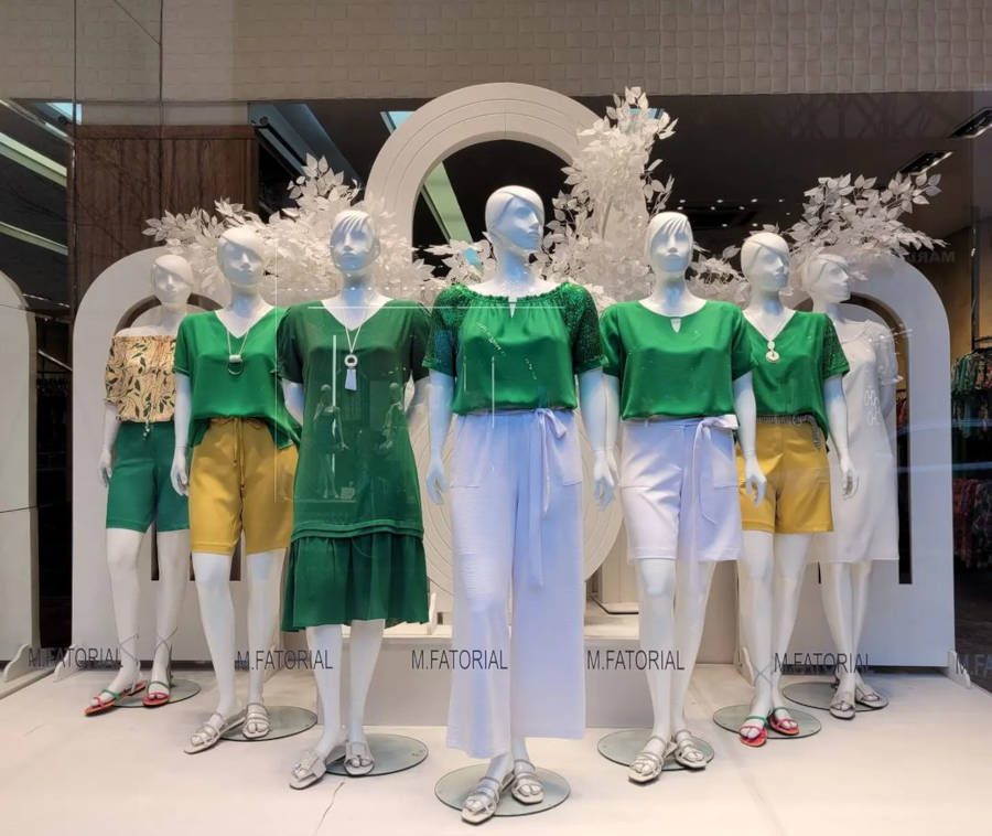 Showcase with green clothes.