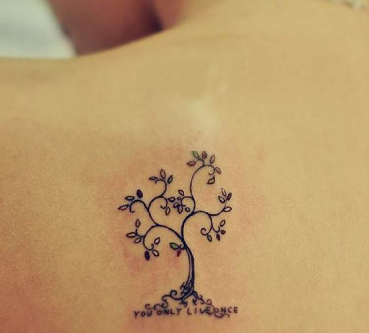 Delicate tree tattoo on back