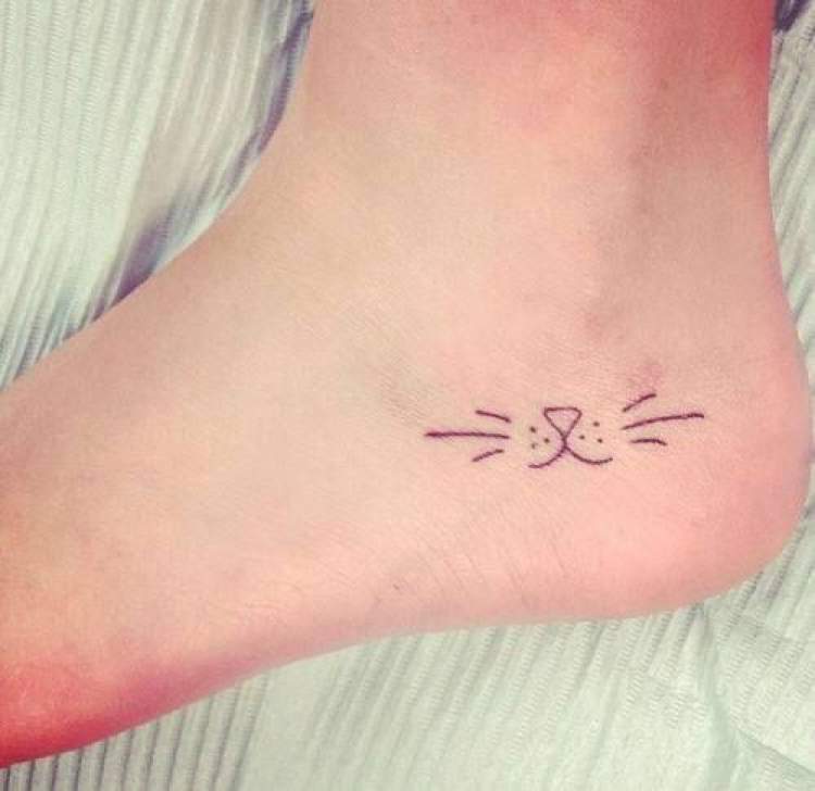 Delicate tattoo for cat lovers