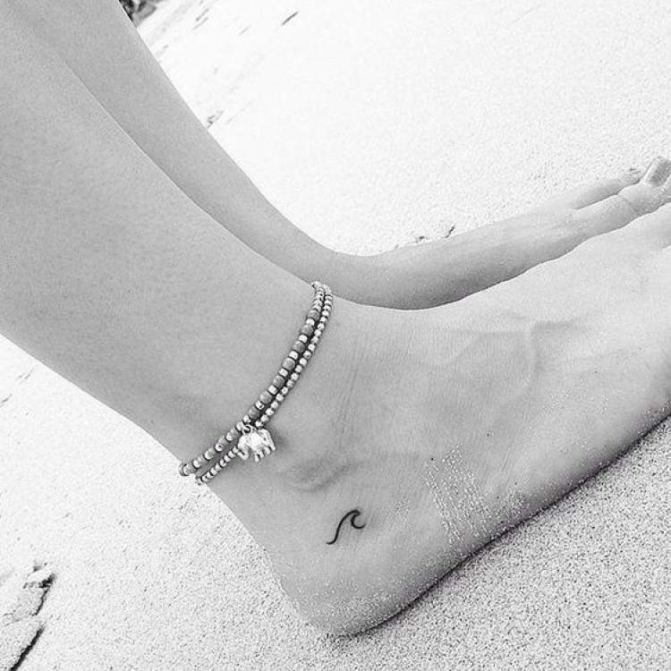 Delicate foot tattoo