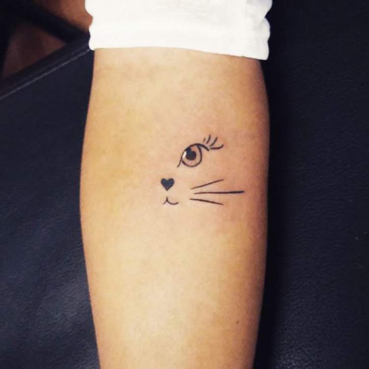 Cat tattoo on arm