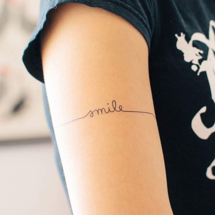 Phrase as delicate tattoo