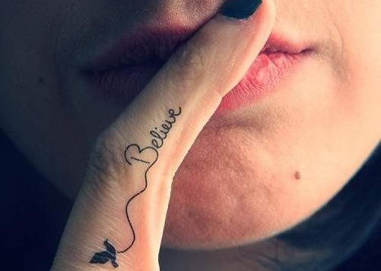 Phrase tattooed on finger