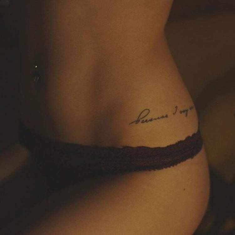 Delicate writing tattoo