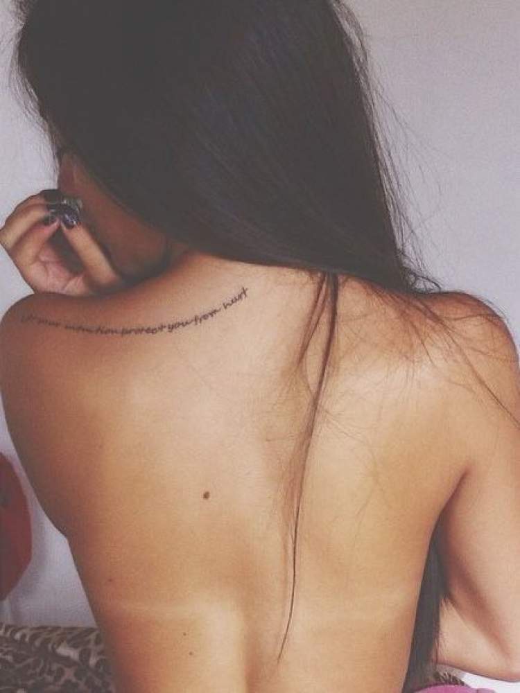 Phrase tattooed on the back