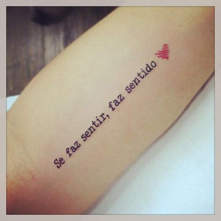 Phrase tattoo on arm