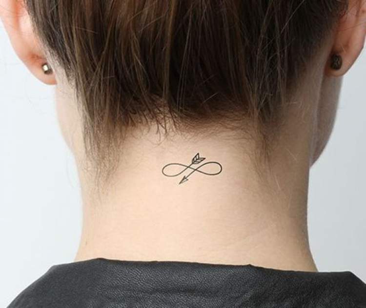 Delicate tattoo behind the neck with an arrow design