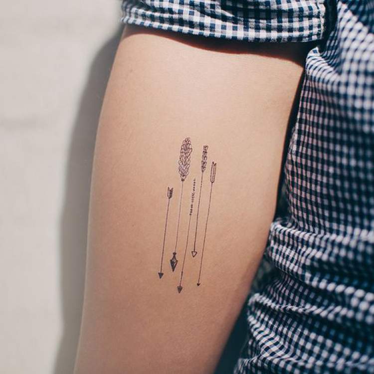 Arrows tattooed on the arm