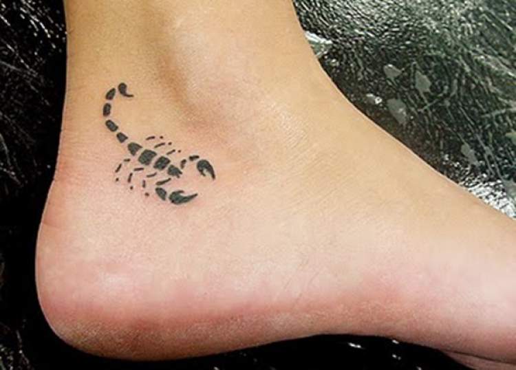 Delicate scorpion tattoo