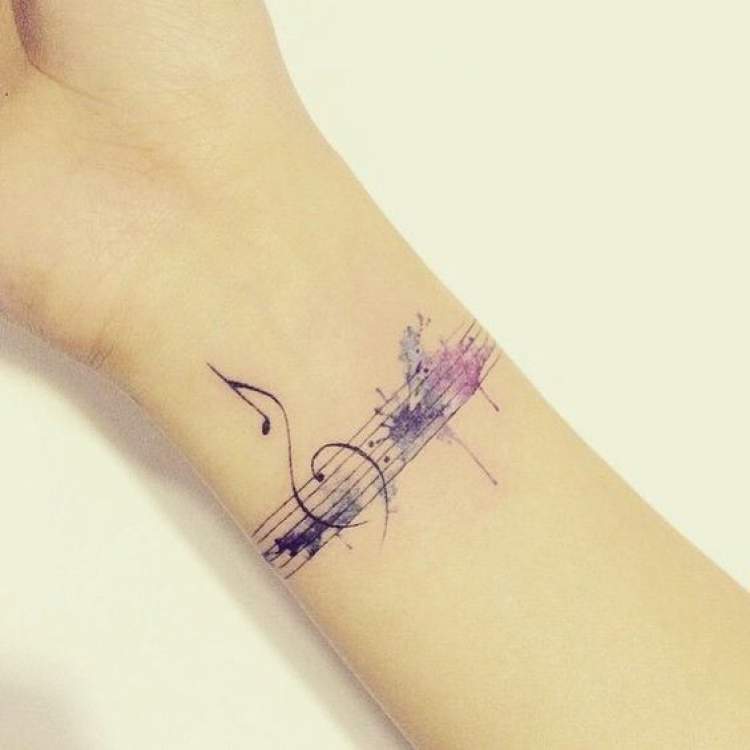 Female tattoo inspired by music