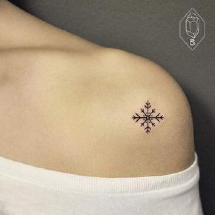 Delicate feminine shoulder tattoo