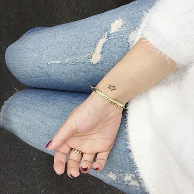 small star tattoo on wrist