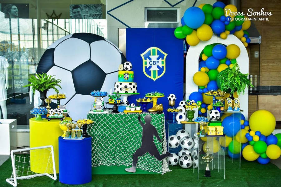 Decoration with three-tier cake and football.