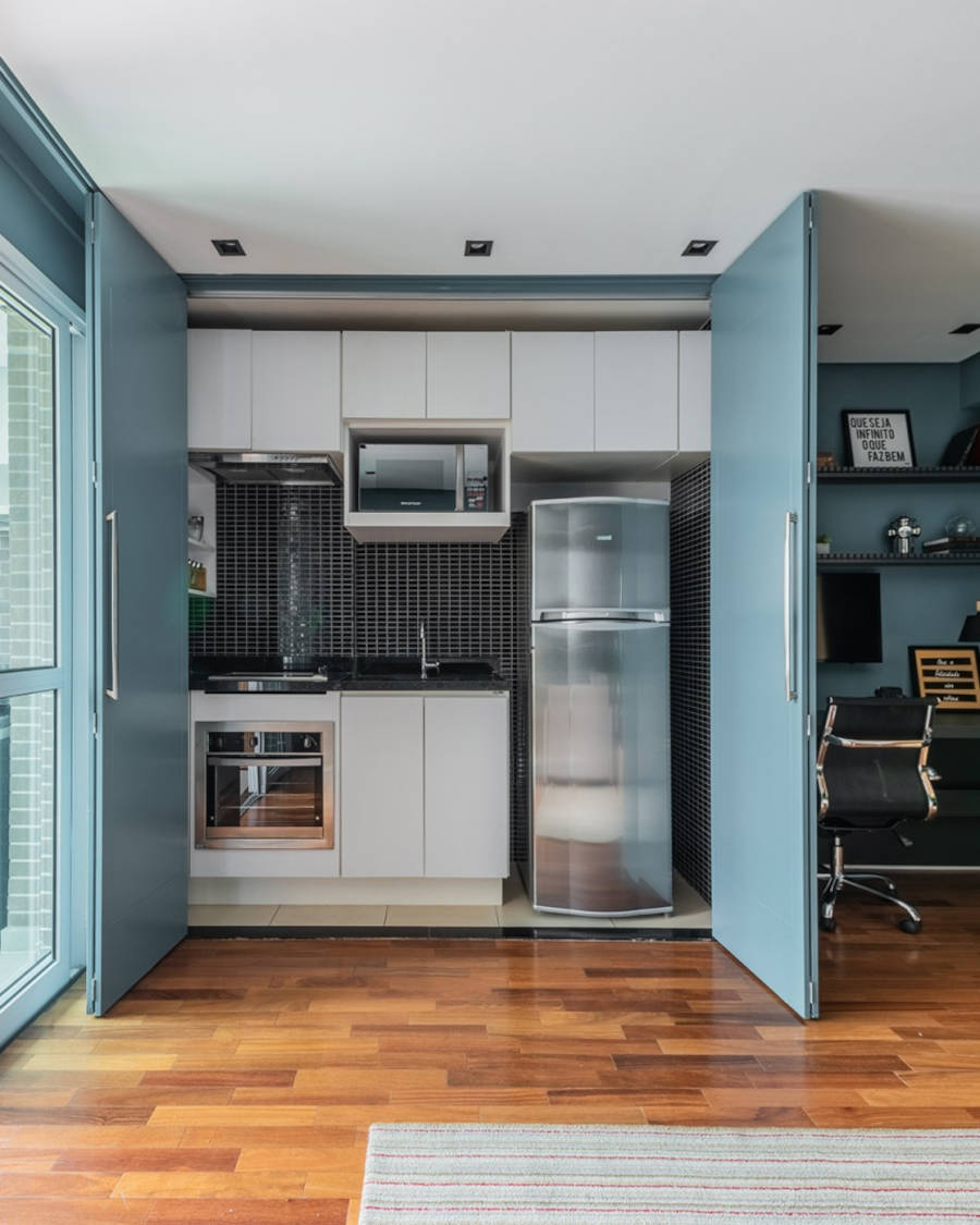 Small kitchen with blue doors.