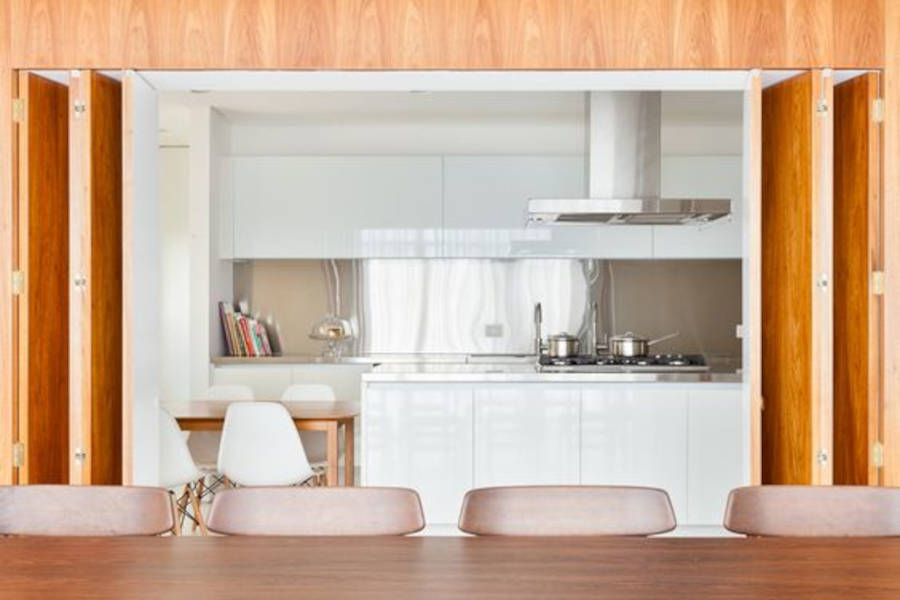 American kitchen with hood and table.