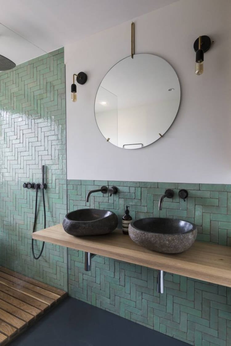 Green tile and black sink.