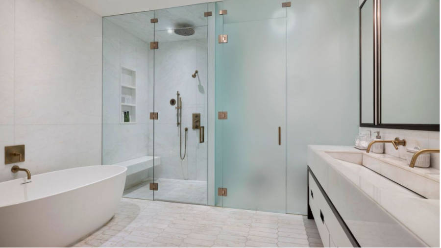 Main bathroom with separate bathtub and shower.