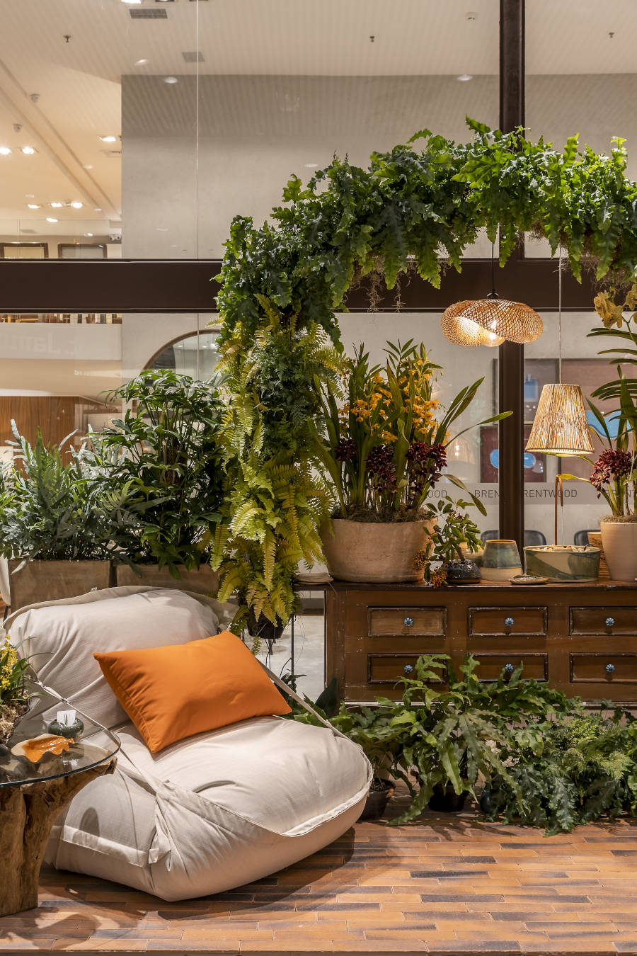 Pull soft with wooden dresser and plant arch.