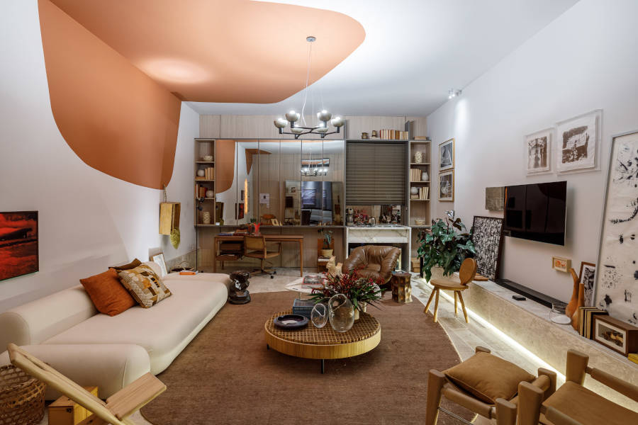 TV room with white and brown wall.