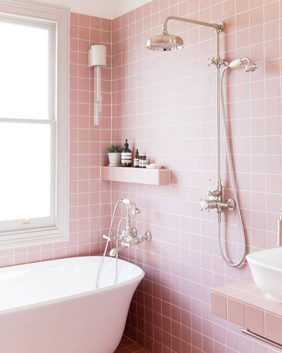 Colorful house with pink tiled bathroom.