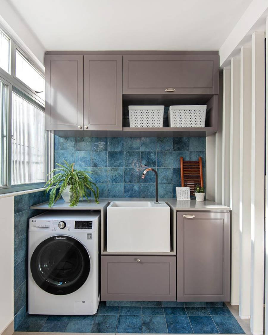 Laundry room with blue tiles and gray closet.