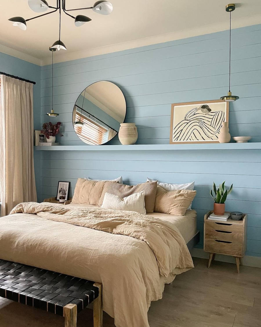 Colorful house with blue wall in the double bedroom.