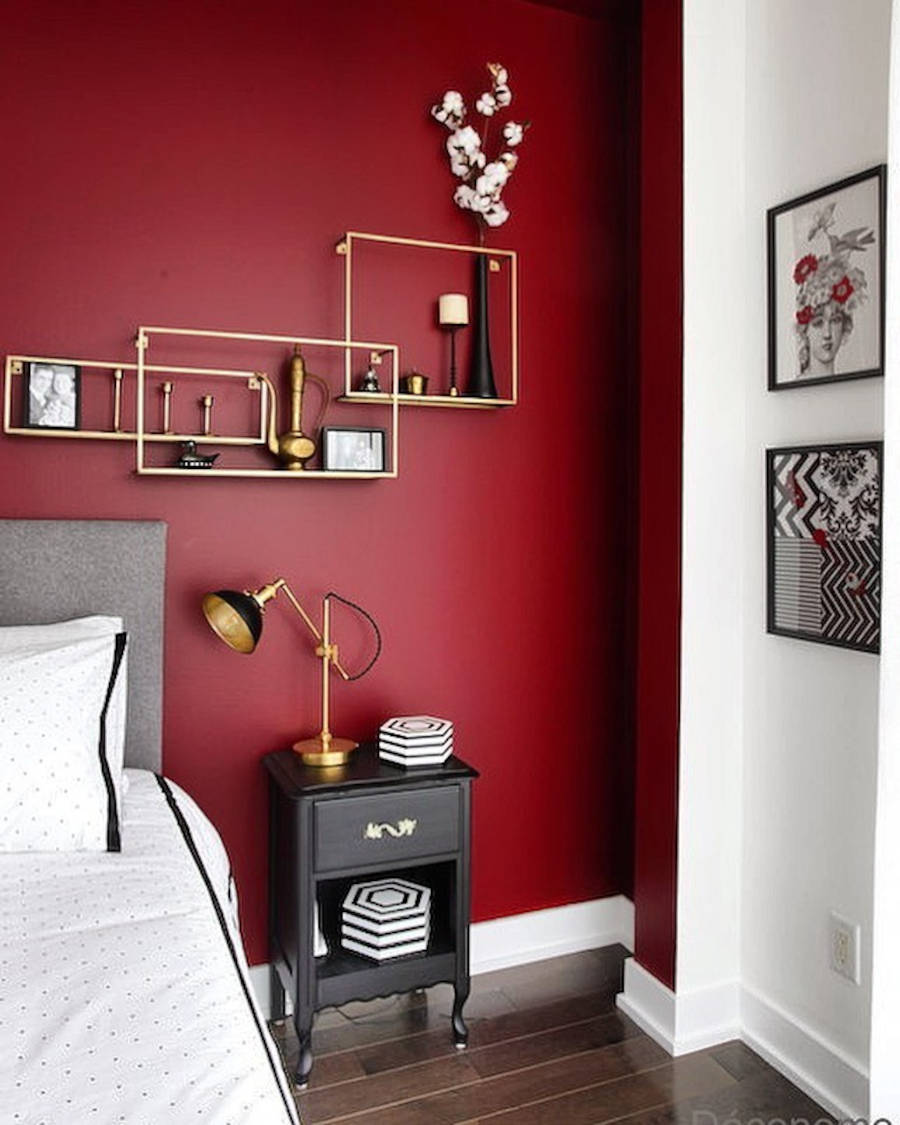 Colorful house with bedroom with dark red wall.