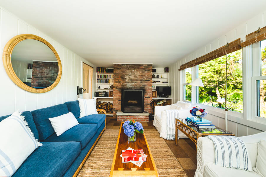 Sarah Jessica Parker's beach house with living room with fireplace.