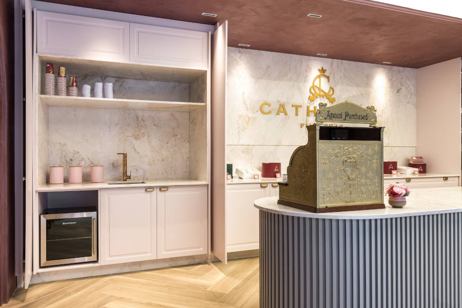 White hidden kitchen cabinet.