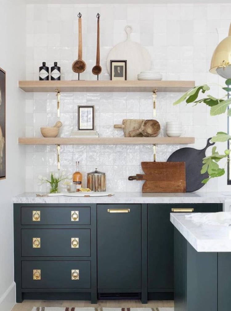 Black and white kitchen. Golden ring on black cabinet.