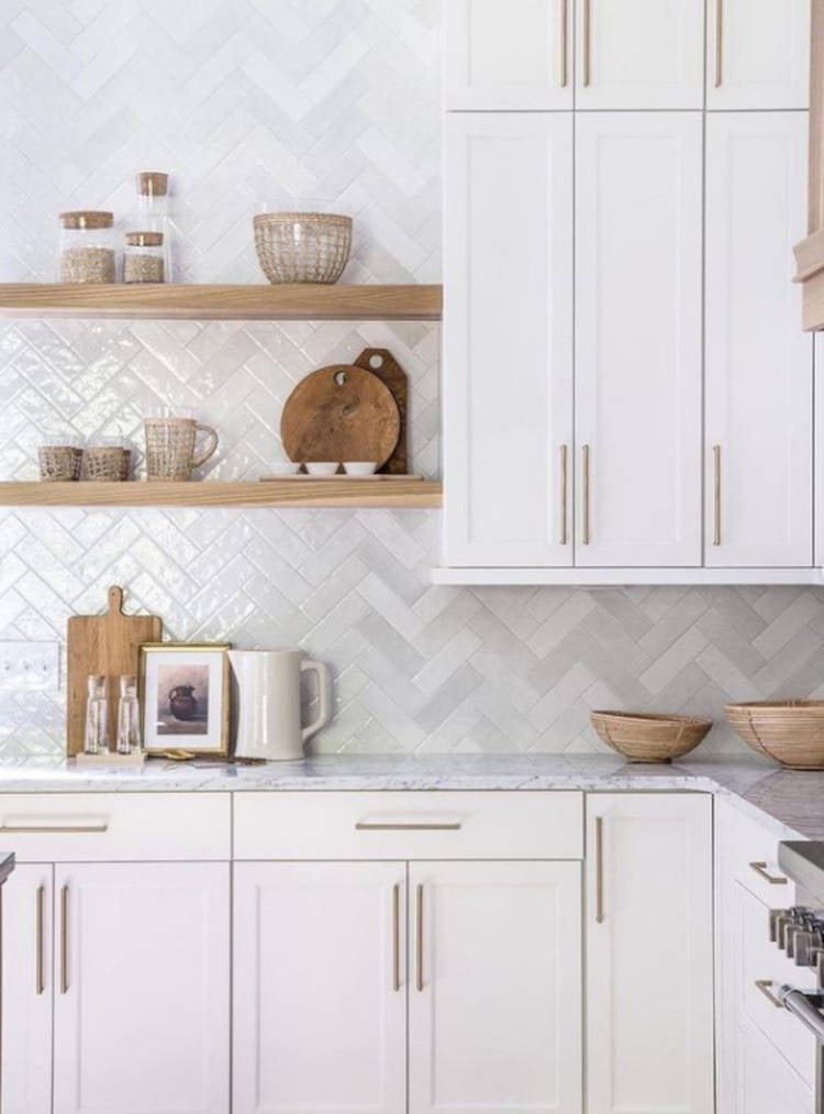 White kitchen with gold handles. Custom kitchen cabinet with handle handle.