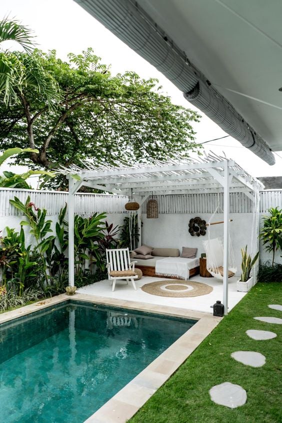 Swimming pool and white pergola.