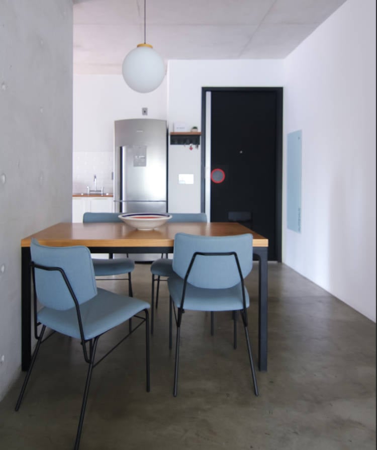 Dining room with blue chairs.