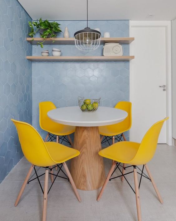 Blue wall and yellow chairs.