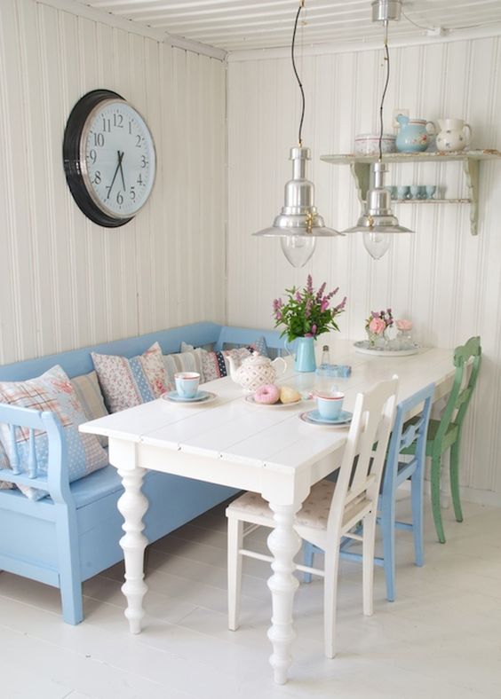 Dining room with blue sofa.