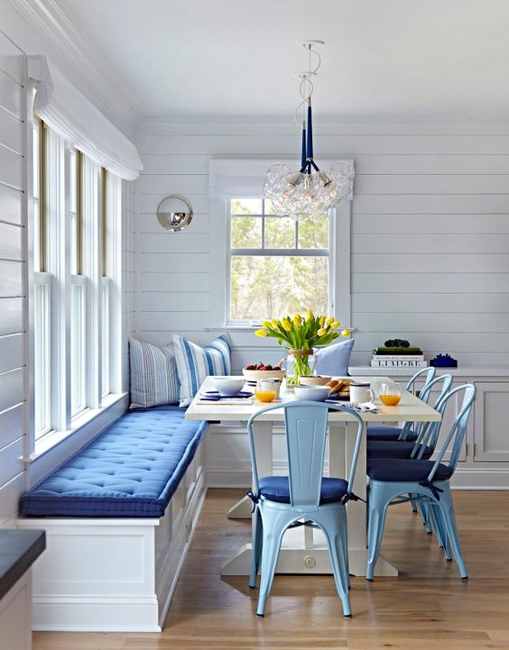 Dining room with blue cushions.