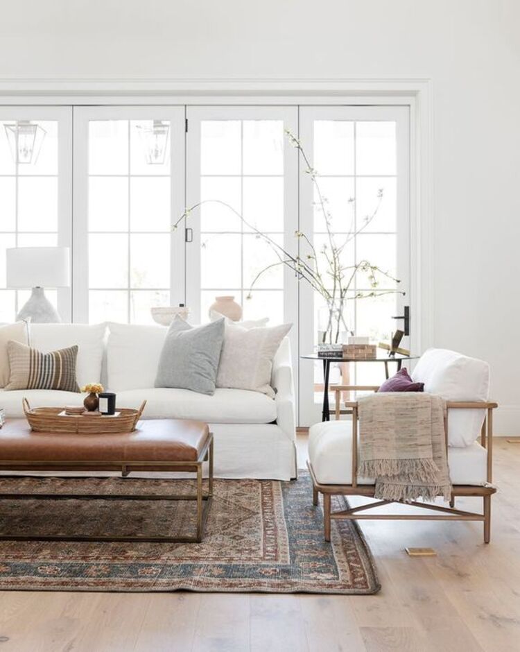 Living room with white sofa and armchair.