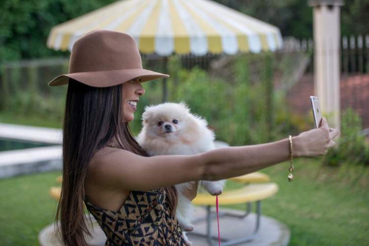 Photo of Priscila Rocha with a puppy